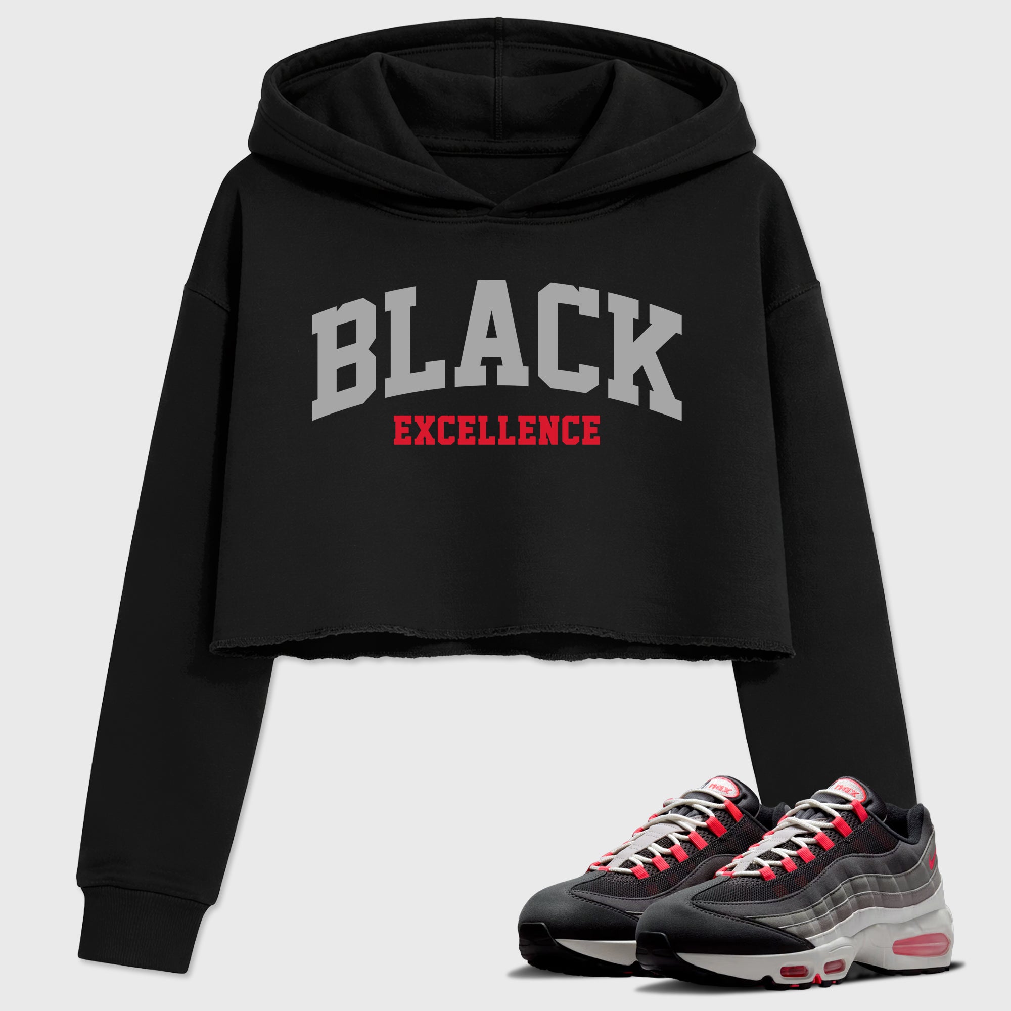Varsity Black Excellence Women’s Graphic Crop Tee featuring original streetwear artwork designed to match the Air Max 95 Reverse Solar Red. Black 1 Crop Tee.