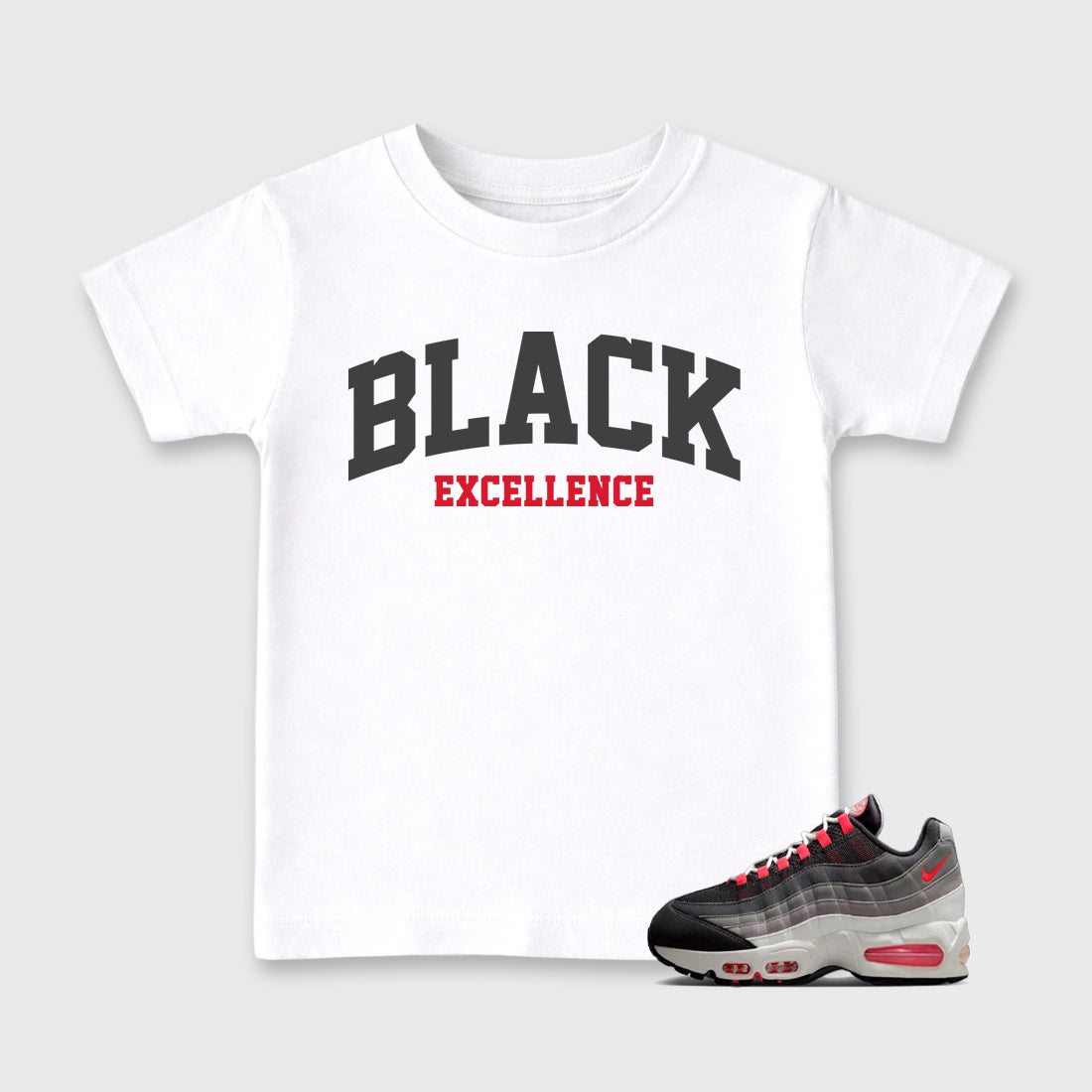 Varsity Black Excellence Baby & Kids Graphic T-Shirt featuring original artwork designed to match the Air Max 95 Reverse Solar Red. White 1 Kids Graphic Tee.