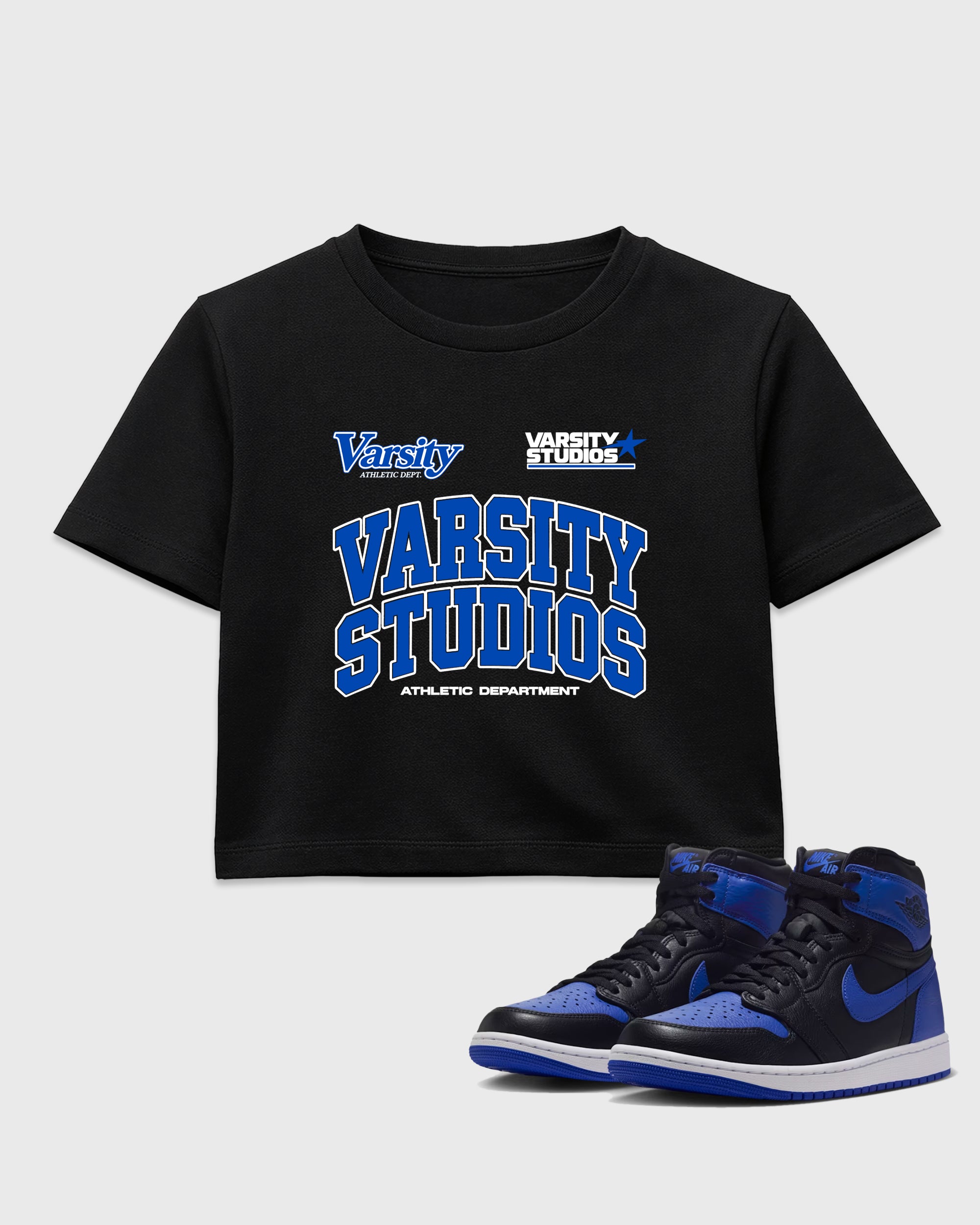 Varsity Studios women’s crop tee designed to match the Air Jordan 1 High OG 'Royal', featuring coordinated Black 1 options for a perfect streetwear vibe.