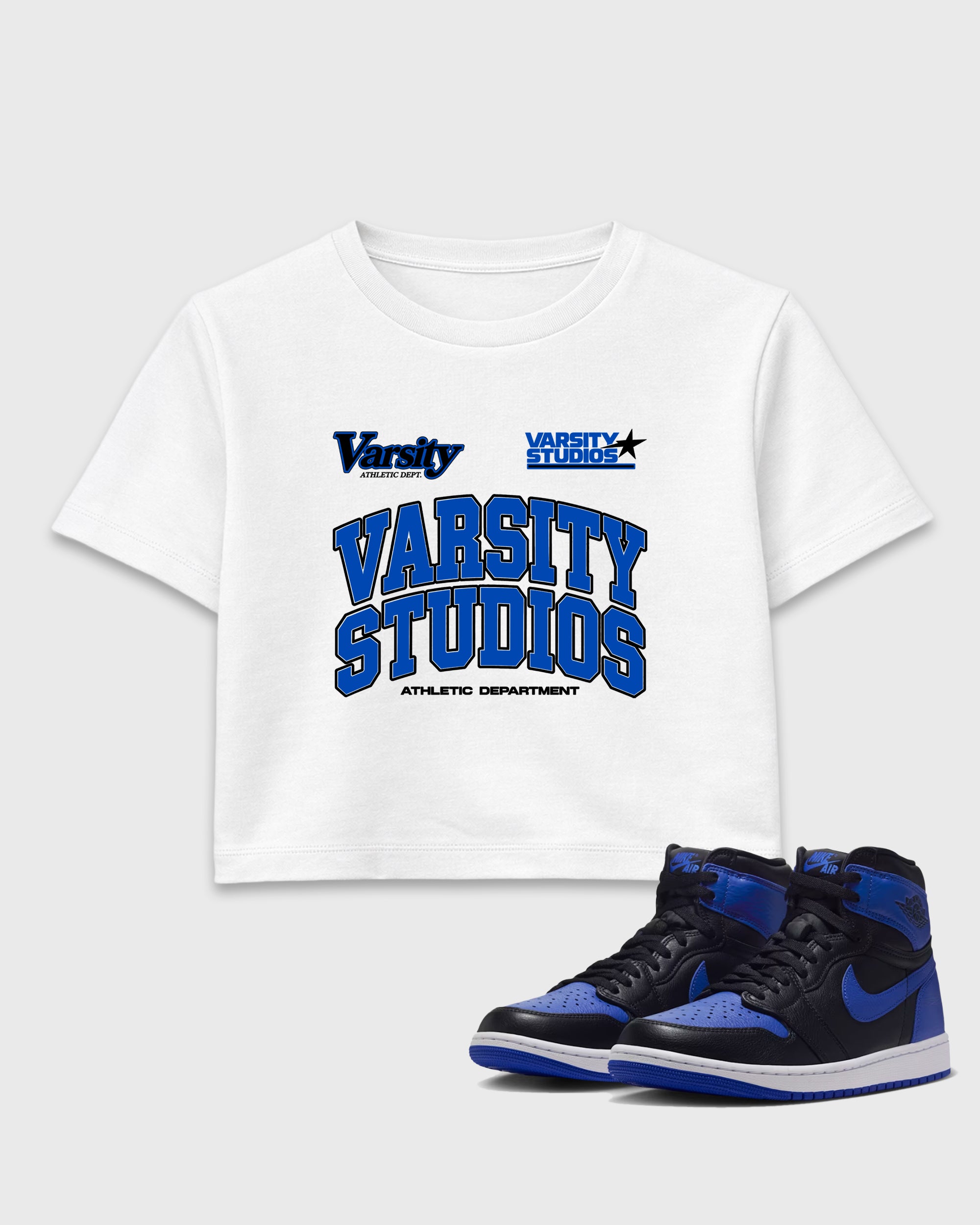 Varsity Studios women’s crop tee designed to match the Air Jordan 1 High OG 'Royal', featuring coordinated White 1 options for a perfect streetwear vibe.