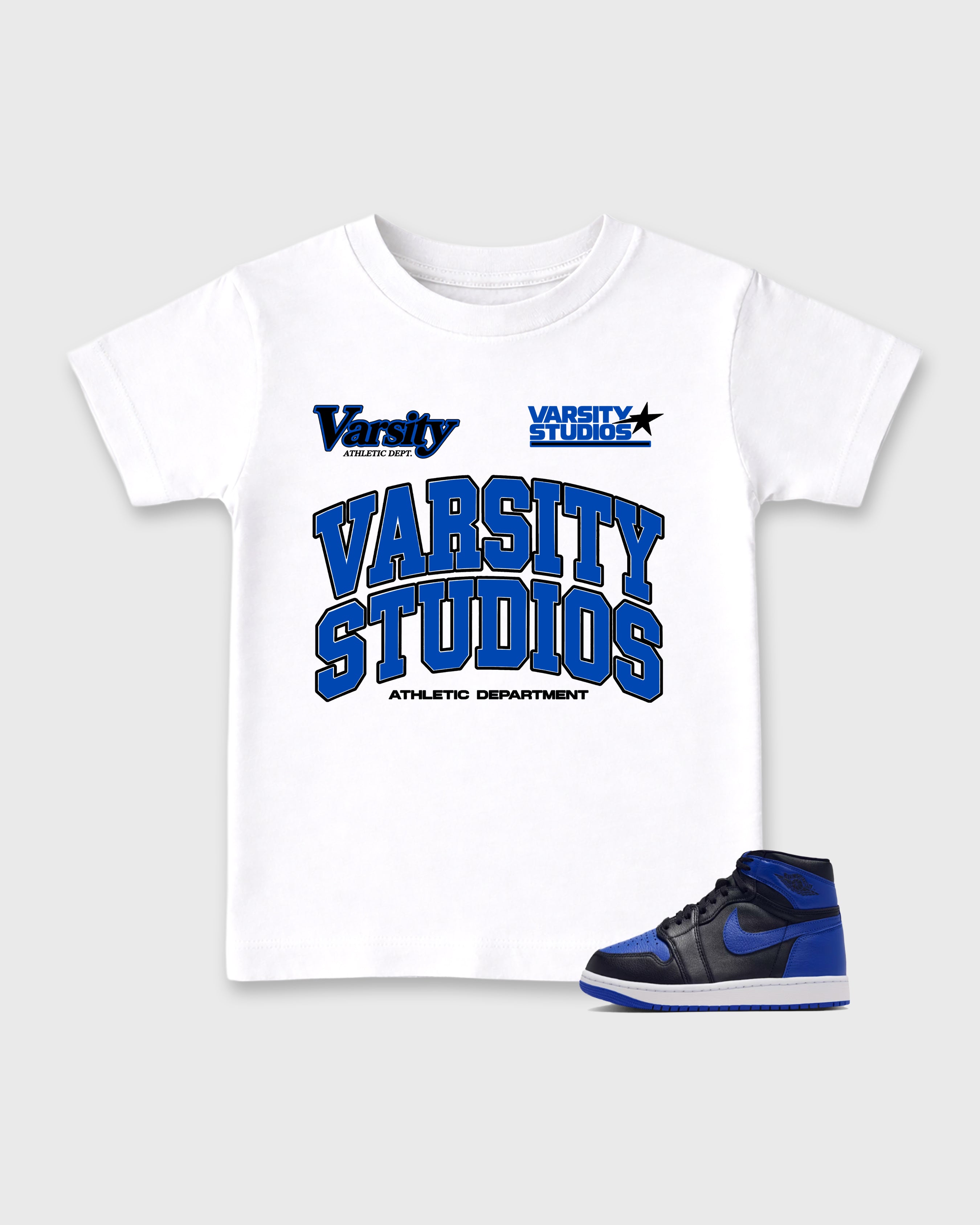 Varsity Studios Baby & Kids Graphic T-Shirt featuring original artwork designed to match the Air Jordan 1 High OG 'Royal'. White 1 Kids Graphic Tee.