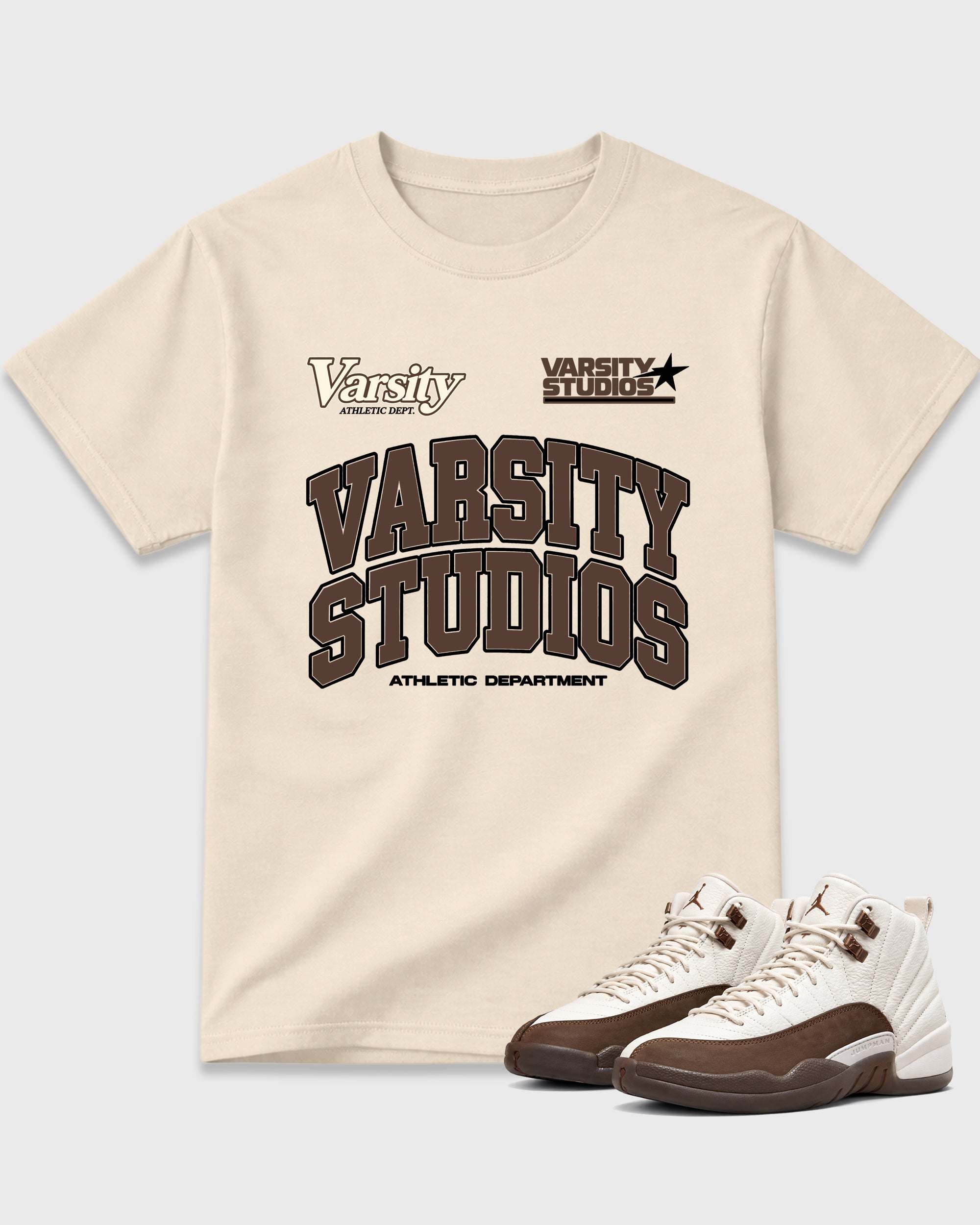 Varsity Studios Graphic T-Shirt featuring original streetwear artwork designed to match the Air Jordan 12 Fireside. Natural 1 Graphic T-Shirt.