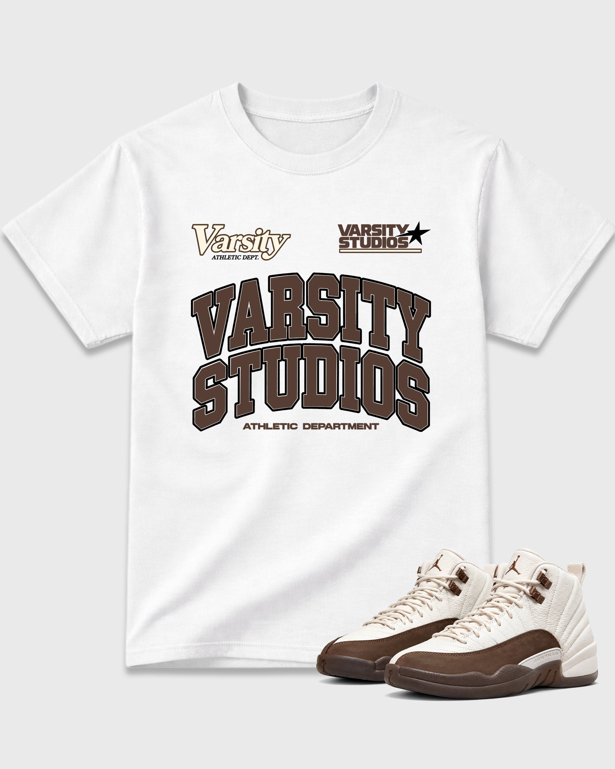 Varsity Studios Graphic T-Shirt featuring original streetwear artwork designed to match the Air Jordan 12 Fireside. White 1 Graphic T-Shirt.