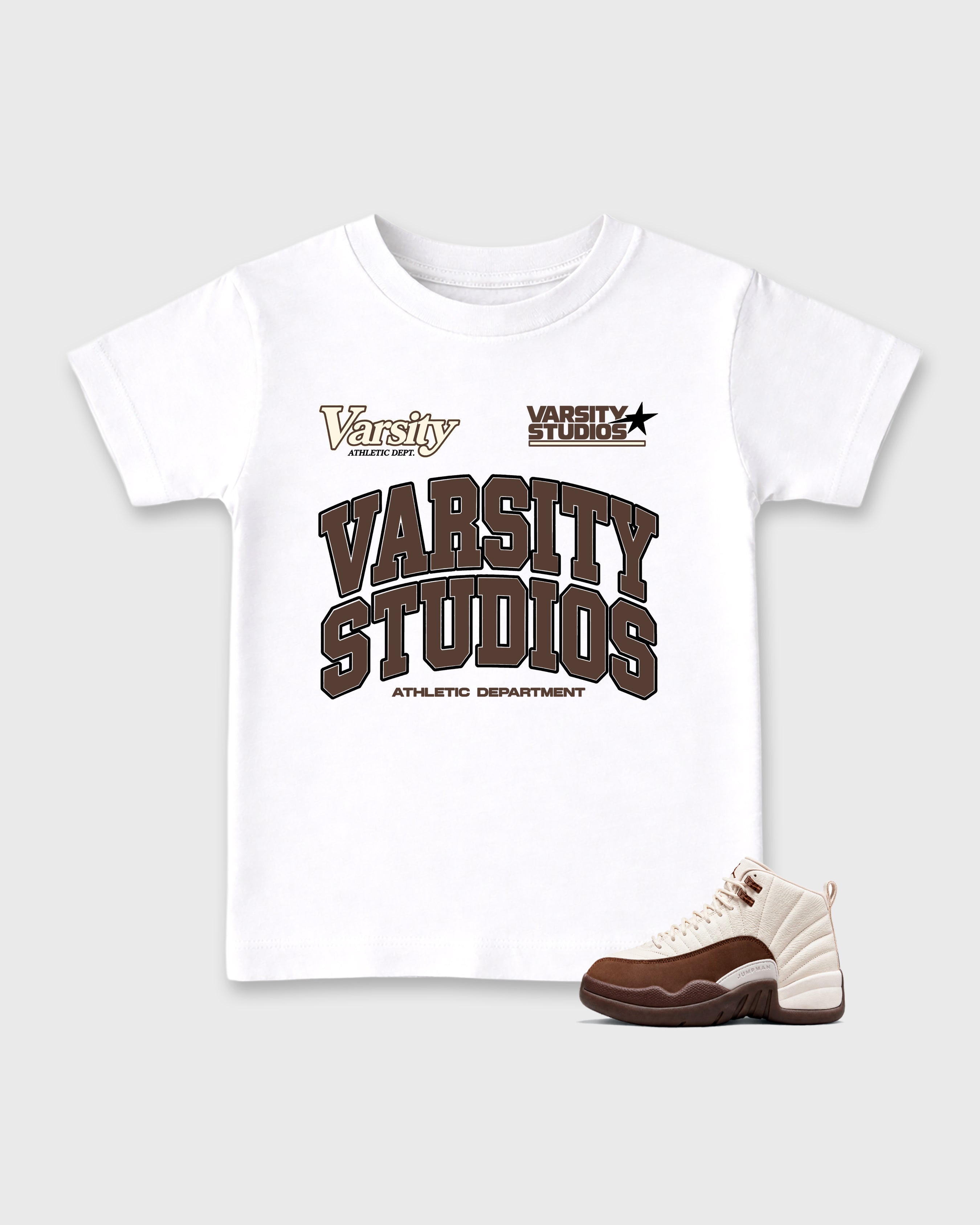 Varsity Studios Baby & Kids Graphic T-Shirt featuring original artwork designed to match the Air Jordan 12 Fireside. White 1 Kids Graphic Tee.