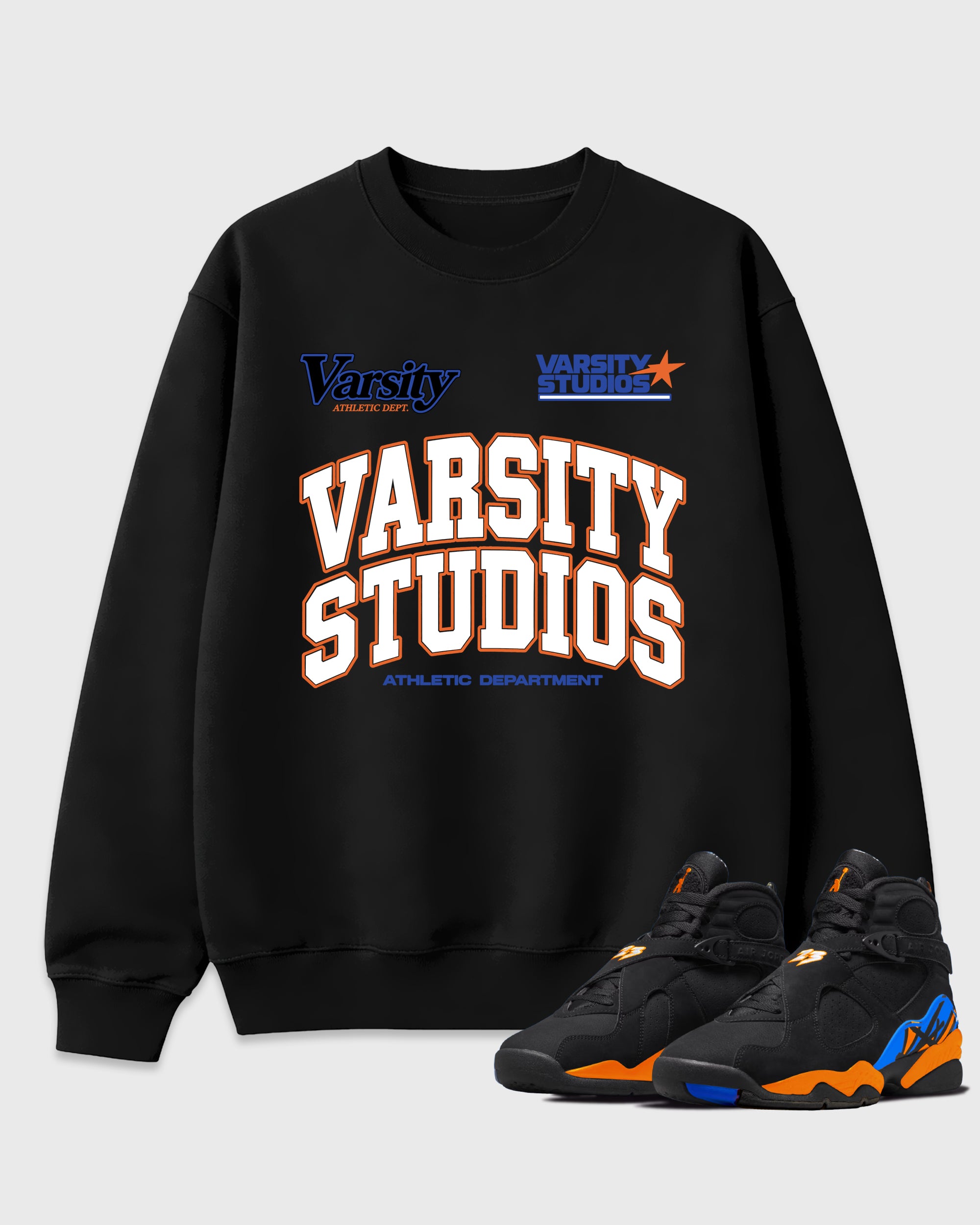 Varsity Studios Graphic T-Shirt featuring original streetwear artwork designed to match the Air Jordan 8 Knicks. Black 1 Graphic Tee.