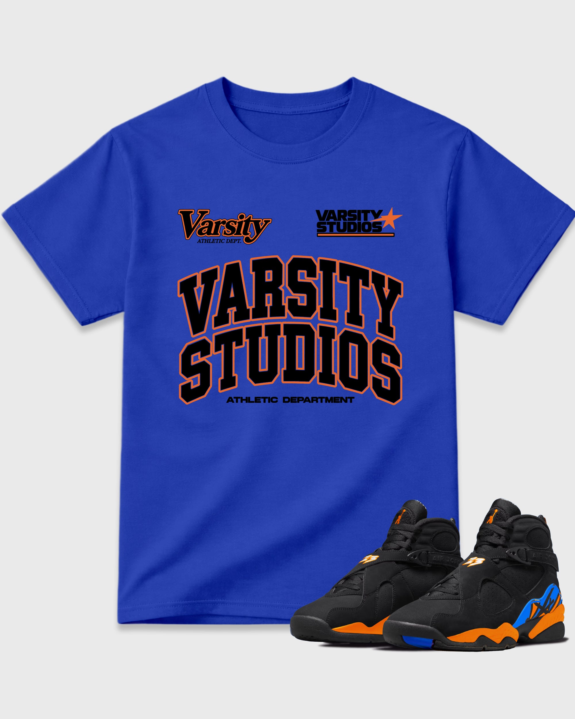 Varsity Studios Graphic T-Shirt featuring original streetwear artwork designed to match the Air Jordan 8 Knicks. Royal Blue 1 Graphic T-Shirt.
