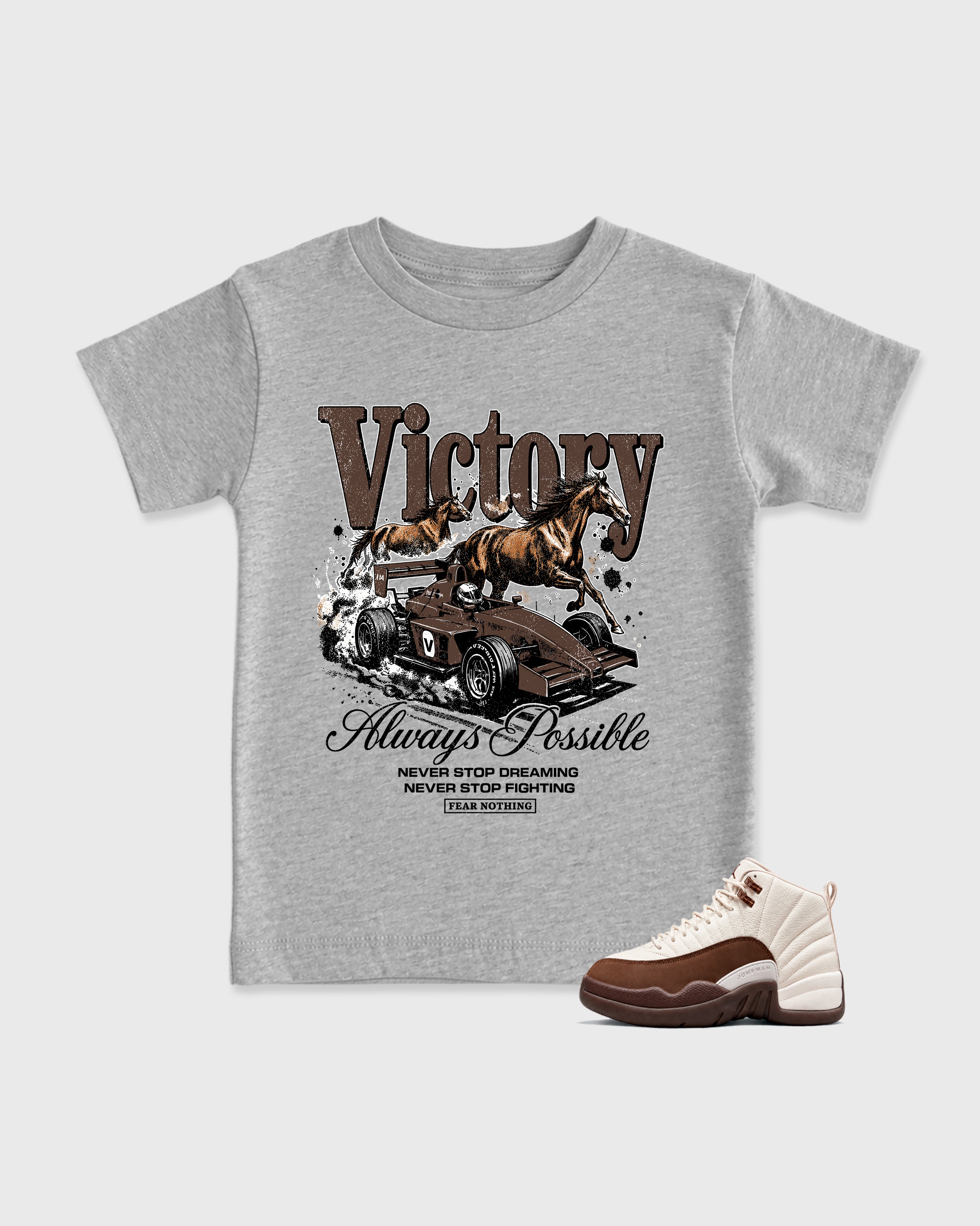 Victory Baby & Kids Graphic T-Shirt featuring original artwork designed to match the Air Jordan 12 Fireside. Heather Grey 1 Kids Graphic Tee.