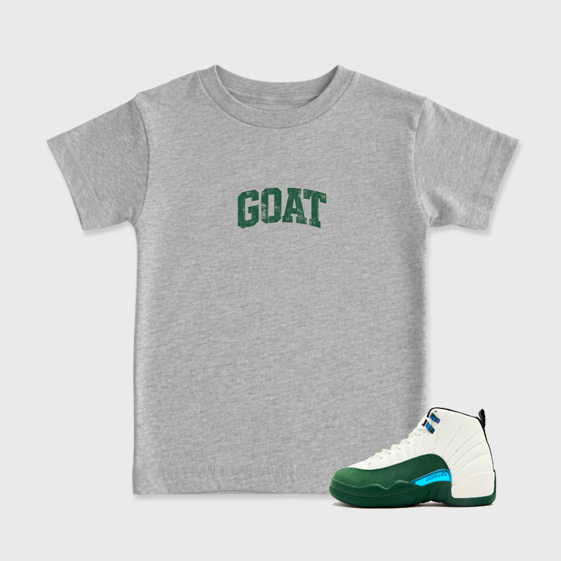 Vintage Goat Baby & Kids Graphic T-Shirt featuring original artwork designed to match the Air Jordan 12 Summit Green. Heather Grey 1 Kids Graphic Tee.
