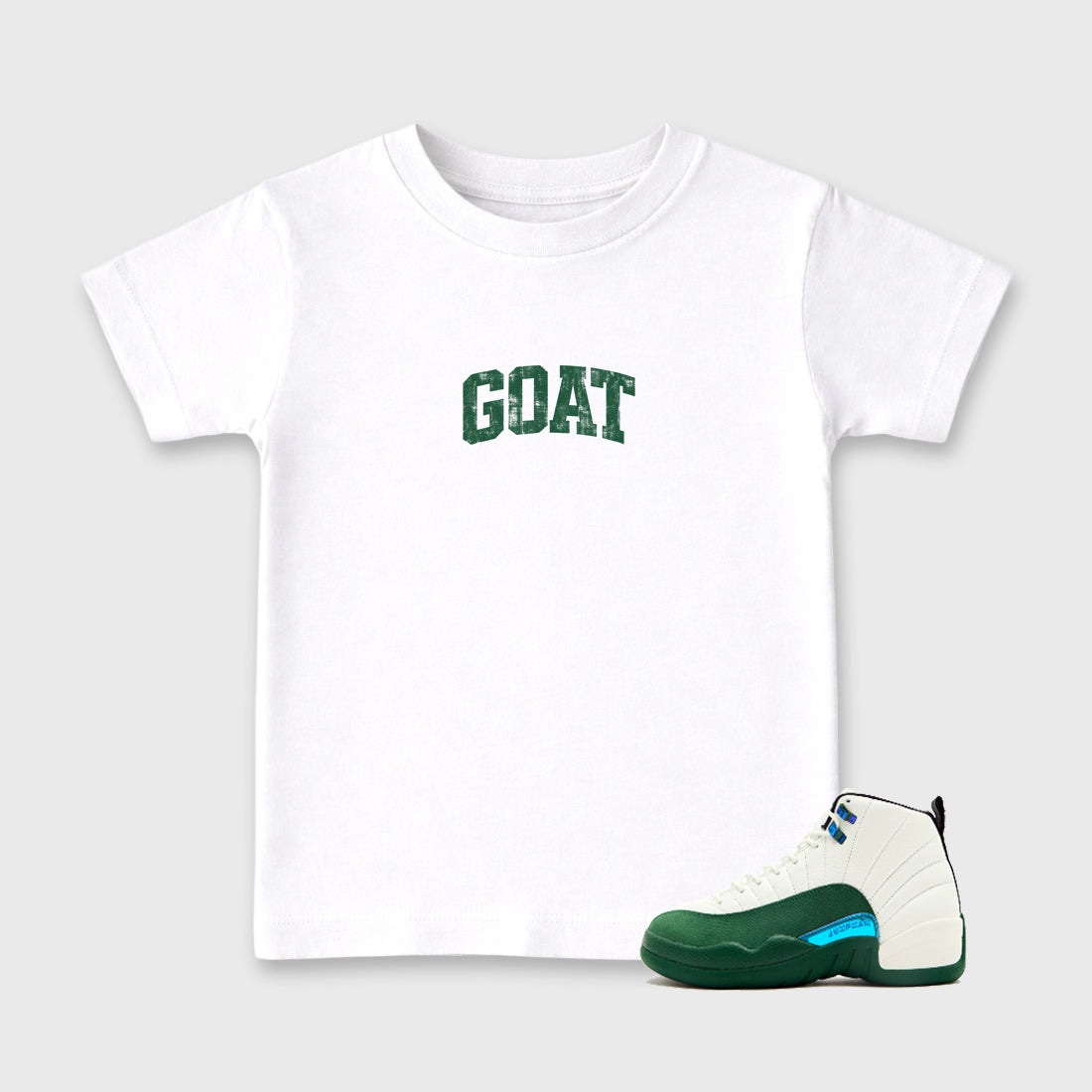 Vintage Goat Baby & Kids Graphic T-Shirt featuring original artwork designed to match the Air Jordan 12 Summit Green. White 1 Kids Graphic Tee.