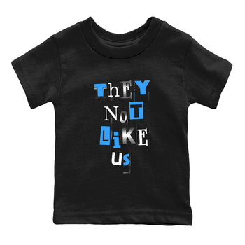 Vintage They Not Like Us baby and kids t-shirt crafted for little sneakerheads to shine with the Air Jordan 12 White and University Blue sneakers, displayed in Black 2.