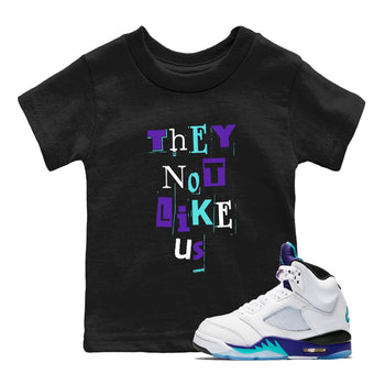 Vintage They Not Like Us baby and kids t-shirt crafted for little sneakerheads to shine with the Air Jordan 5 Grape sneakers, displayed in Black 1.