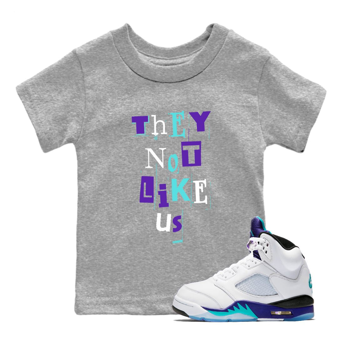 Vintage They Not Like Us baby and kids t-shirt crafted for little sneakerheads to shine with the Air Jordan 5 Grape sneakers, displayed in Heather Grey 1.
