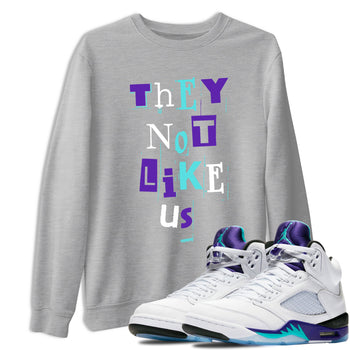 Vintage They Not Like Us sneaker match t-shirt styled to complete your fit with the Air Jordan 5 Grape sneakers, shown in Heather Grey 1.
