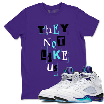 Vintage They Not Like Us sneaker match t-shirt styled to complete your fit with the Air Jordan 5 Grape sneakers, shown in Purple 1.