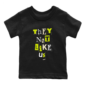 Vintage They Not Like Us baby and kids t-shirt crafted for little sneakerheads to shine with the Jordan Jumpman Jack Travis Scott Bright Cactus sneakers, displayed in Black 2.