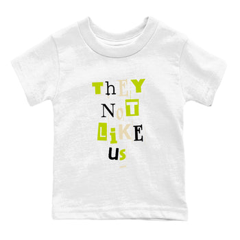 Vintage They Not Like Us baby and kids t-shirt crafted for little sneakerheads to shine with the Jordan Jumpman Jack Travis Scott Bright Cactus sneakers, displayed in White 2.