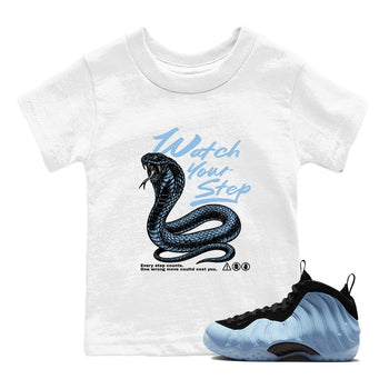 Watch Your Step baby and kids t-shirt crafted for little sneakerheads to shine with the Air Foamposite One Psychic Blue sneakers, displayed in White 1.