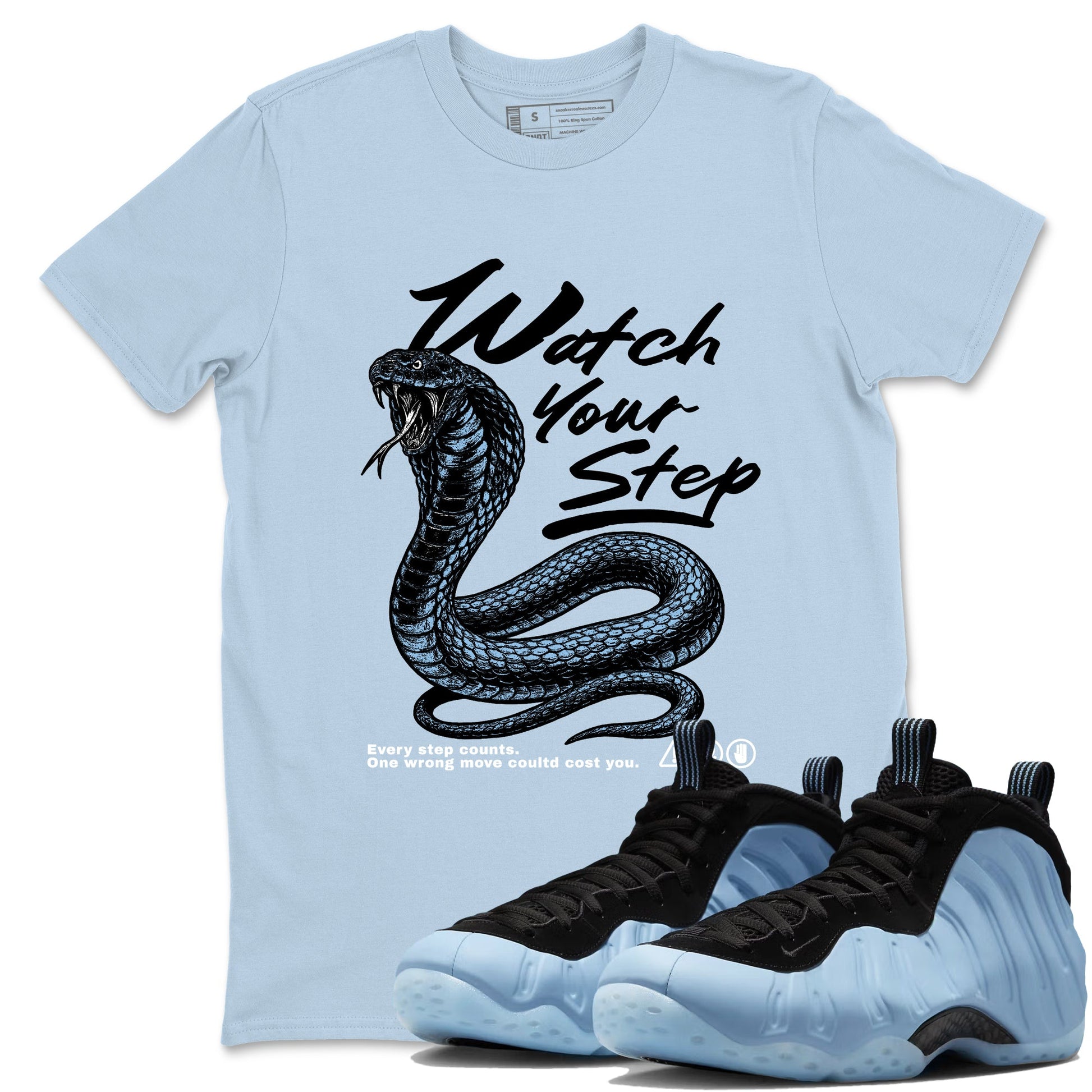 Watch Your Step sneaker match t-shirt styled to complete your fit with the Air Foamposite One Psychic Blue sneakers, shown in Light Blue 1.
