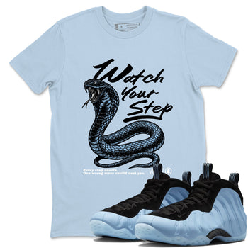 Watch Your Step sneaker match t-shirt styled to complete your fit with the Air Foamposite One Psychic Blue sneakers, shown in Light Blue 1.
