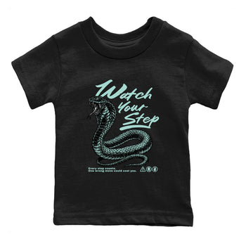 Watch Your Step baby and kids t-shirt crafted for little sneakerheads to shine with the Air Jordan 11 Igloo sneakers, displayed in Black 2.