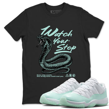 Watch Your Step sneaker match t-shirt styled to complete your fit with the Air Jordan 11 Igloo sneakers, shown in Black 1.
