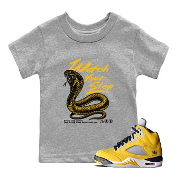 Watch Your Step baby and kids t-shirt crafted for little sneakerheads to with the Air Jordan 5 Tokyo sneakers, displayed in Heather Grey 1.