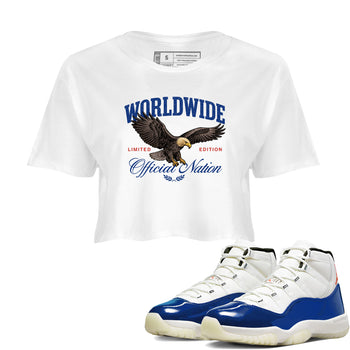 White t-shirt with eagle graphic and sneakers on a white background