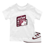 1s Metallic Burgundy shirt to match jordans Vintage Toy Packaging sneaker tees AJ1 Metallic Burgundy SNRT Sneaker Release Tees Baby Toddler White 1 T-Shirt